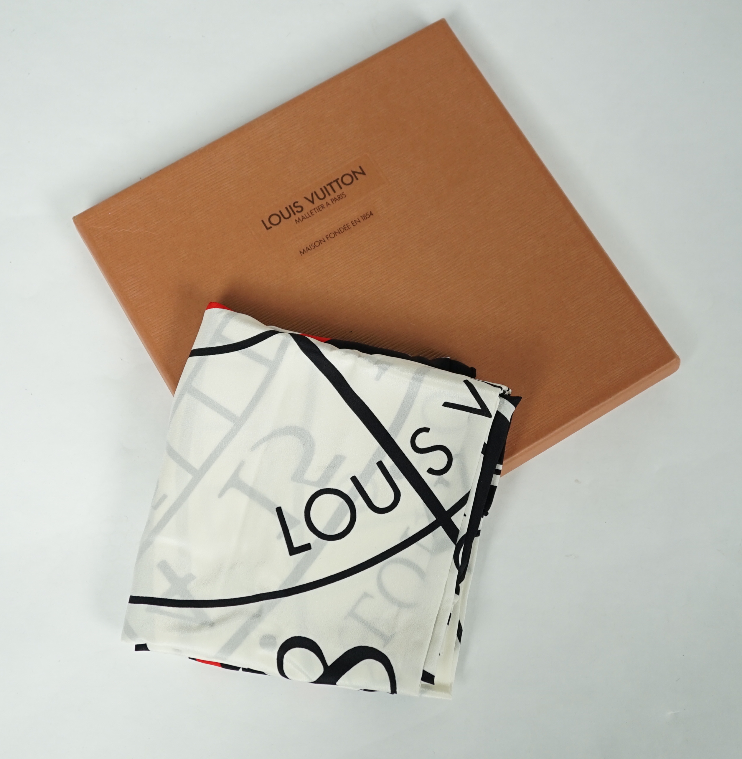 A Louis Vuitton, Cartier and Pucci boxed scarves